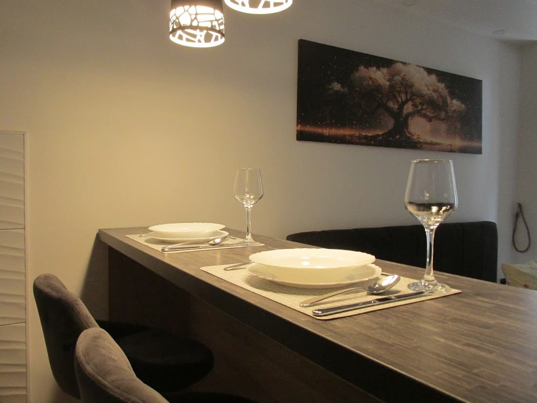 Bar table set for two with wine glasses
